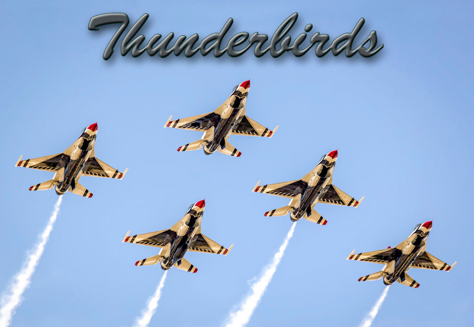 Five fighter jets performing a formation flight with the word 'Thunderbirds' above against a clear blue sky.