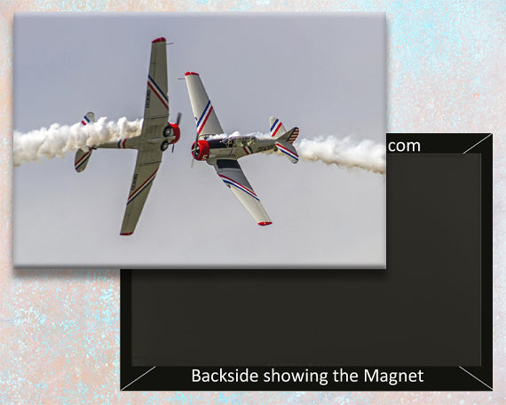 A fridge magnet shaped like the nose of an SNJ-2 military trainer aircraft with a red and blue design.