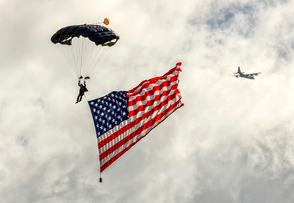 3.25"x2.25" handmade fridge magnet of Parachuter with American Flag and military aircraft